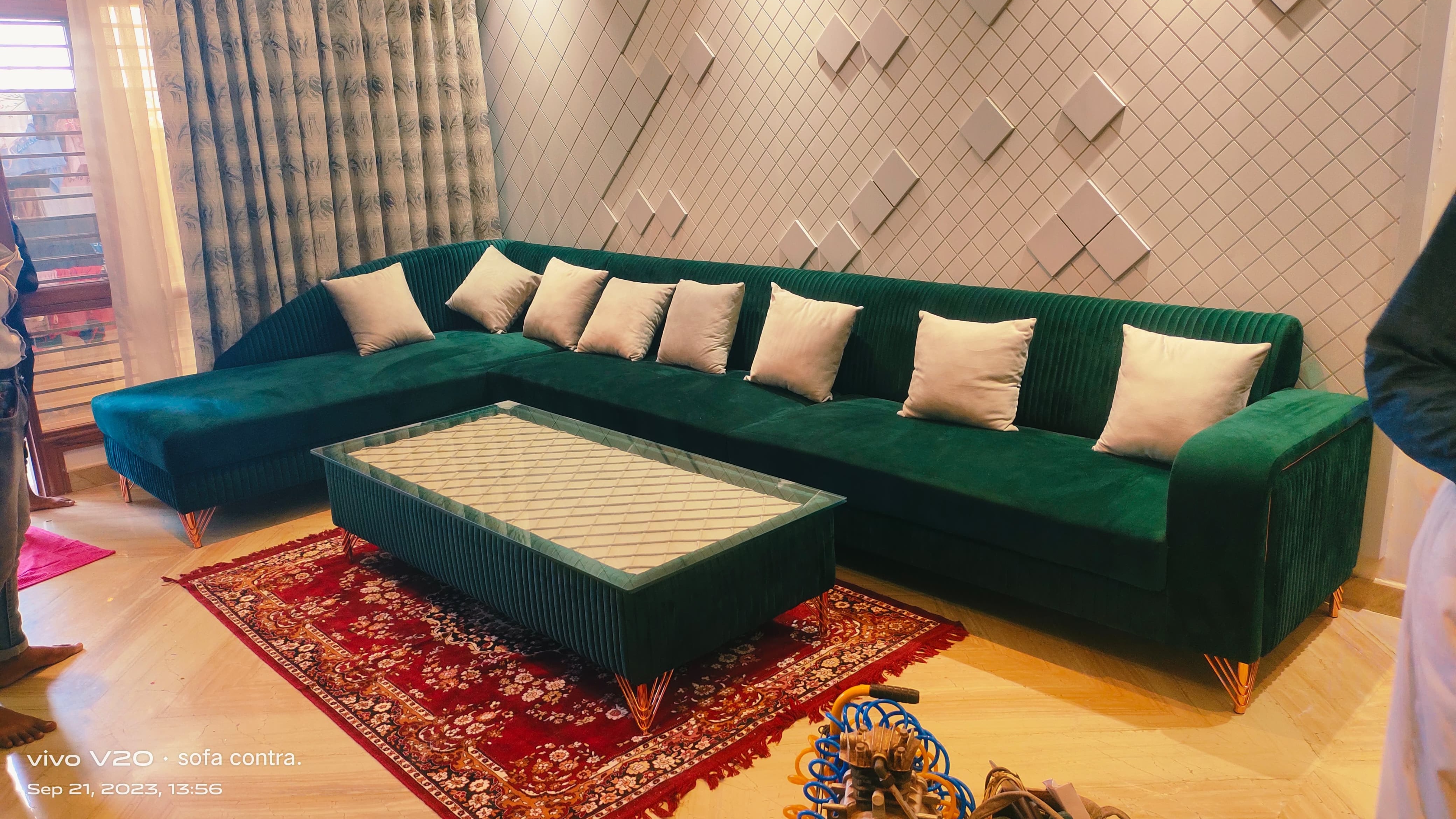 Green velvet luxury sofa with cushions
